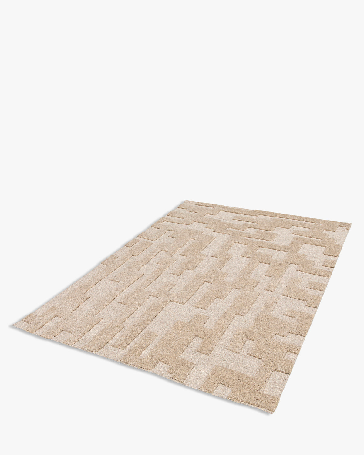 tapis de salon Piazza rectangulaire écru à motif sable en relief - vue de trois quarts