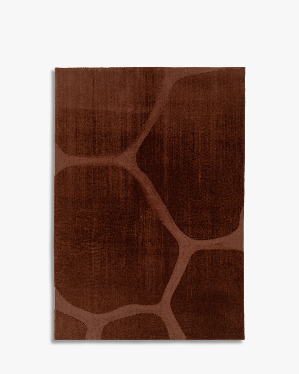 tapis SHELL brun terracotta à larges cellules en relief, vu de dessus sur fond blanc