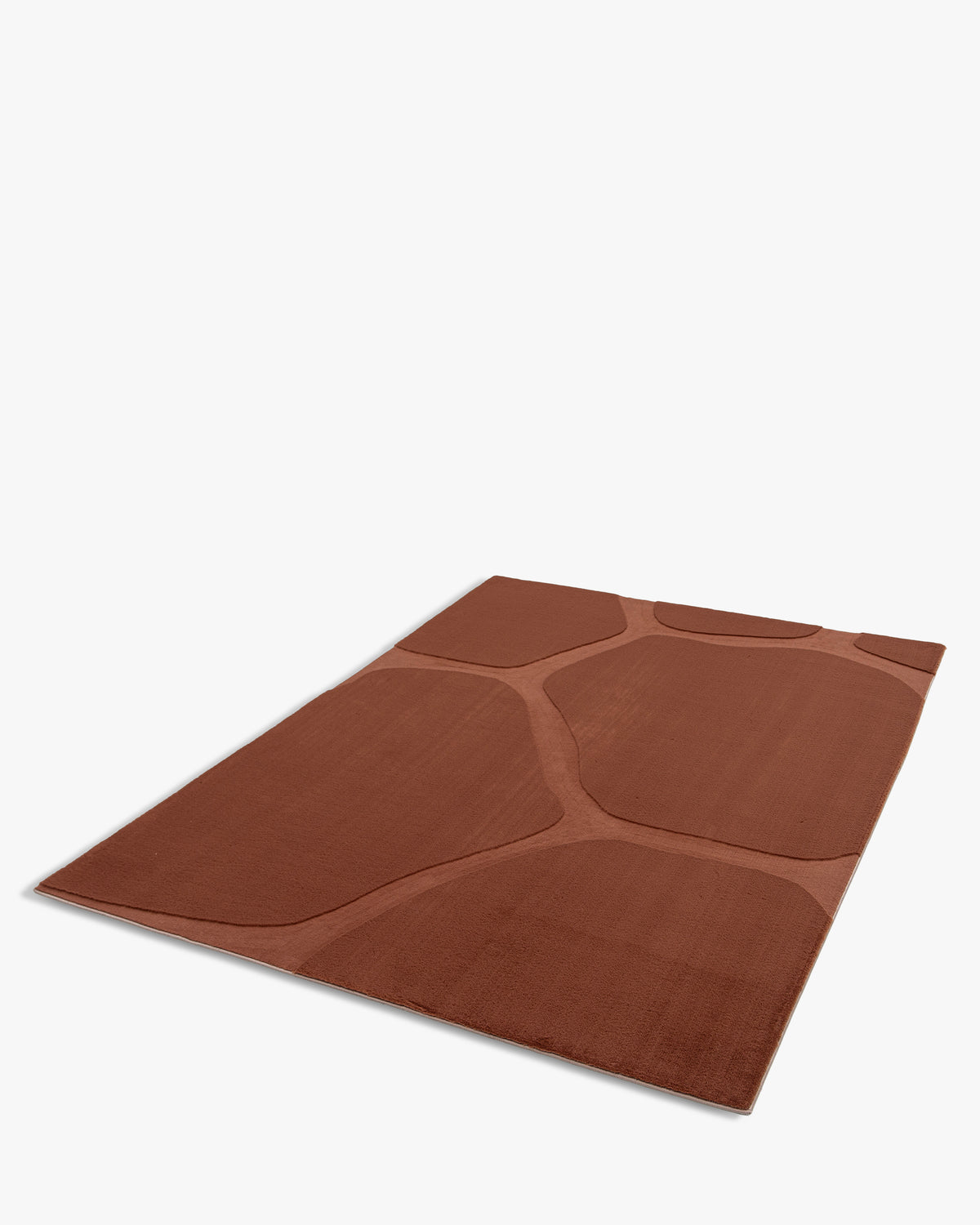 tapis SHELL brun terracotta à larges cellules en relief, posé à plat vu en perspective
